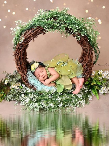 A woodland fairy prince dreams by the water. This magical edit adds a reflective water element to our fairy theme, creating an even more enchanting portrait.