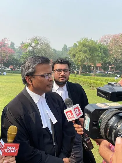 A close-up of a press briefing where I am clarifying legal points to reporters from India Today and Republic TV.
