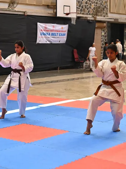 Two students perform their kata in sync during the SSKKA belt exam. This demonstrates their understanding of timing, rhythm, and teamwork.