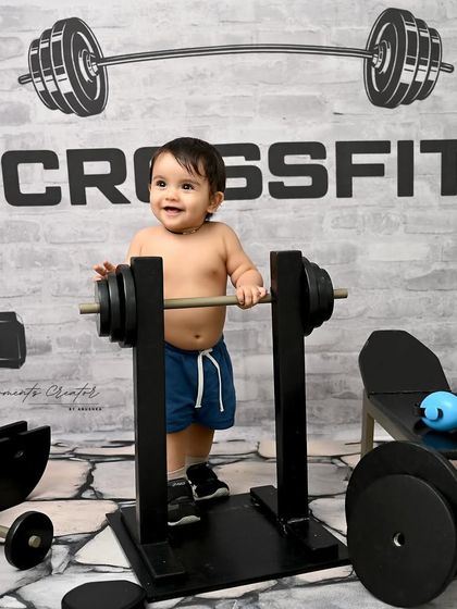 Standing tall and proud at the squat rack. This photo captures a great milestone of standing, combined with a fun and imaginative theme.