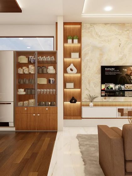 This view highlights the storage solutions in an open-plan living area, including a glass-fronted crockery unit that complements the nearby TV entertainment center.
