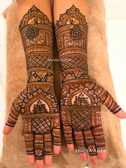 This bride requested a classic design with a modern feel. I used traditional peacock and lotus motifs but arranged them in a contemporary layout with lots of detailed pattern work.