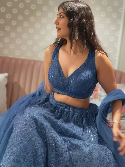 This beautiful blue lehenga is heavier than my life decisions, but so worth it. I love finding intricately detailed pieces like this for wedding functions. The deep blue color and all-over sequin work make it a showstopper.