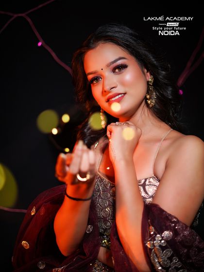 An artistic shot with bokeh lights, adding to the festive and dreamy feel of the Diwali makeup.