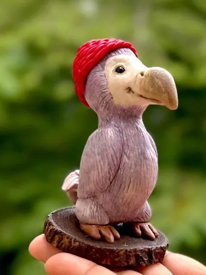 Did you know this is an extinct bird? I was asked to create a Dodo bird, and I loved the challenge. This little guy is wearing a cute beanie, just as the customer requested.