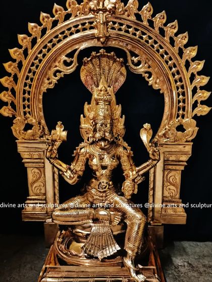 This is a bronze sculpture of Pratyangira Devi, a fierce protector goddess. Her lion face, fiery hair, and multiple arms are sculpted to convey her immense power.