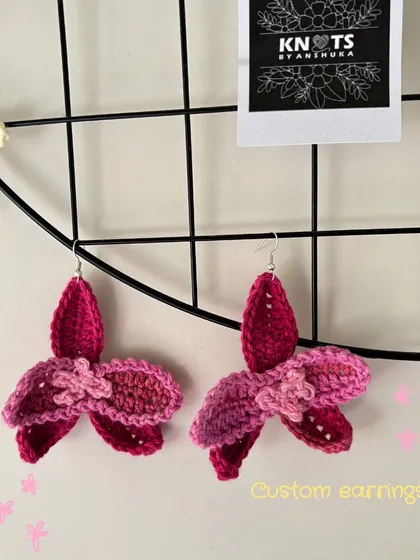 A pair of custom crochet flower earrings. These are lightweight and make a bold, artistic statement.