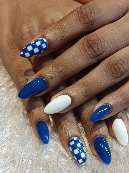 Another angle of our popular blue and white checkerboard design. This set shows how we can create a cohesive and striking look by mixing solid and patterned nails.