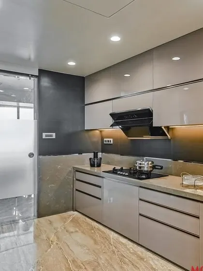 Another angle of the acrylic parallel kitchen, showing the frosted glass door that separates the utility area.
