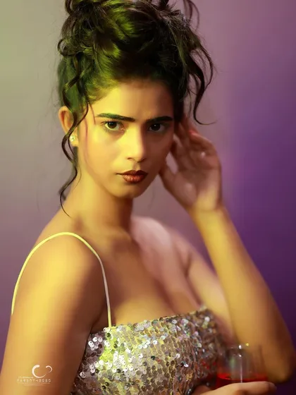A striking close-up with dramatic lighting. The mix of yellow and green light creates a unique and artistic mood.