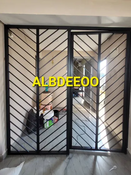 A modern mild steel main door with a chevron pattern. This is a secure and stylish option that we can fabricate for both our prefab structures and traditional homes.