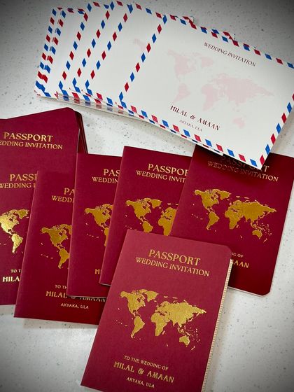 Another look at our passport style wedding invitation, this time in a bold red. It's the perfect choice for any couple planning a destination wedding or with a love for travel.