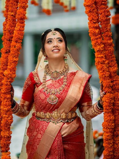 A beautiful upward-looking shot, capturing the bride's happiness and the festive atmosphere.