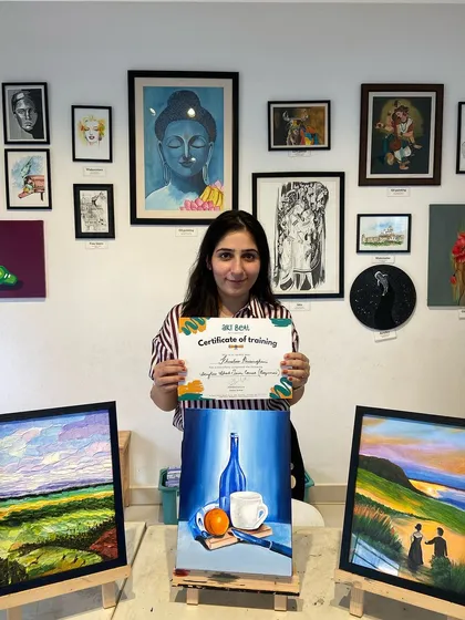 This student's acrylic paintings are full of texture and mood, from a vibrant landscape to a monochromatic still life.