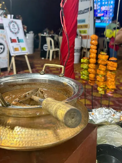 My food stall setup at a pop-up event, featuring a live tandoor station. The combination of delicious Dal Makhani and freshly grilled tikkas always draws a crowd.