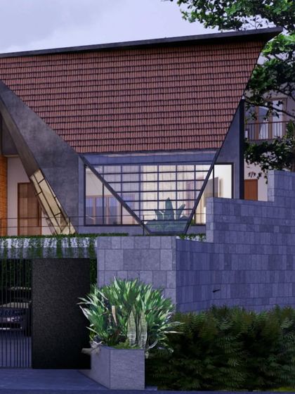 A striking feature of the Hegde Residence is its large, triangulated roof form, which creates a dramatic entryway. This design uses locally sourced Mangalore tiles and glass, blending traditional materials with a bold, contemporary architectural statement.