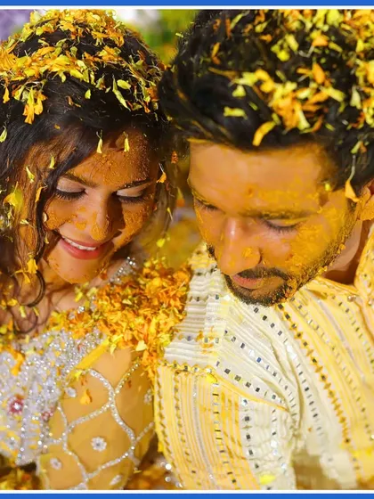 A close-up of the couple, their faces glowing with haldi and happiness. These are the golden moments we love to capture.