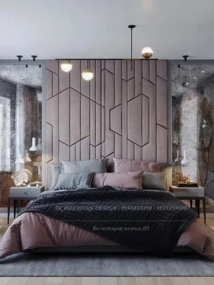 This moody and sophisticated bedroom features a custom geometric headboard in a dusty pink hue. The distressed mirrors on the sides add texture and an industrial-luxe feel.