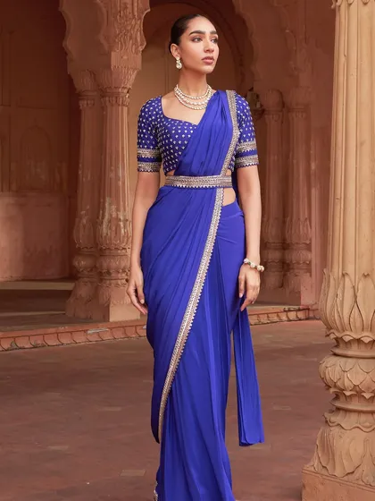The saree is a canvas for personal expression. I updated this classic royal blue drape with a modern, embellished belt and a intricately detailed blouse. This look is perfect for a wedding guest or bridesmaid who appreciates a contemporary twist on timeless elegance.