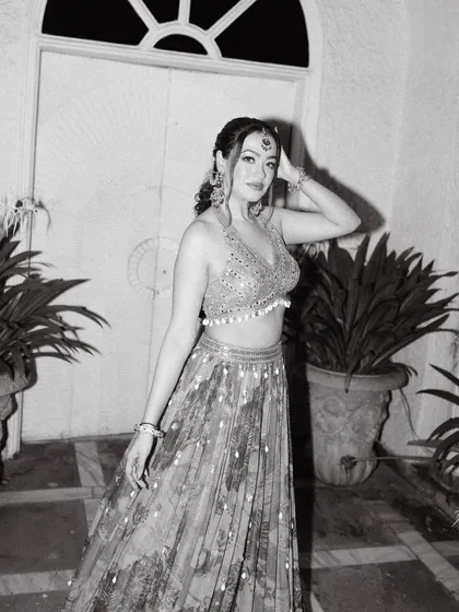 A timeless black and white portrait of the bride, capturing her elegance and style during one of the pre-wedding evening functions.