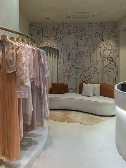 A Parisian-inspired line-art mural for a boutique selling traditional Indian wear. The delicate, hand-painted illustration adds a touch of whimsical elegance to the retail space.