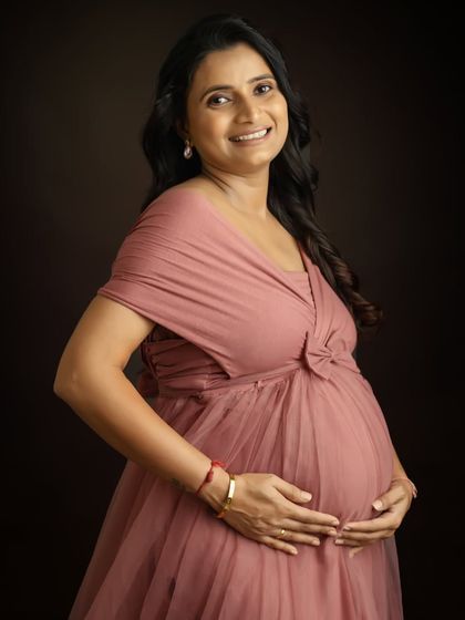 A radiant solo portrait of the mother-to-be. You look so happy and peaceful in this beautiful pink gown, a perfect memory of this special time.