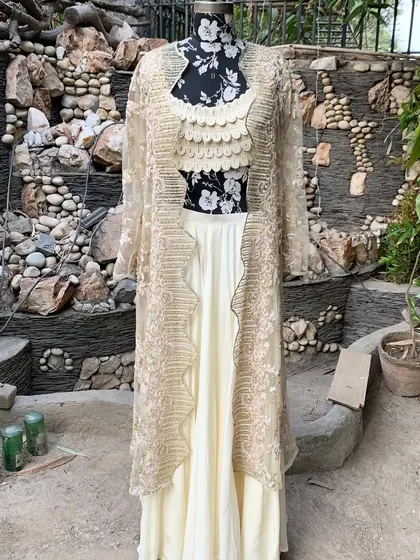 The full view of our beige jacket set. This color is versatile and can be worn for day or evening events.