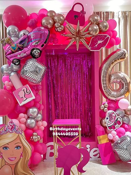 A glamorous and fun Barbie-themed 6th birthday party. The all-pink setup includes a fringe backdrop, themed props like a car and lipstick, and a large foil number '6' balloon.