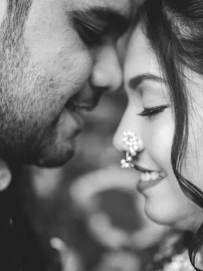Sometimes, black and white photography tells the most emotional story. By removing color, we focus purely on the intimacy and expression between the couple. This close-up captures a quiet, deeply personal moment.