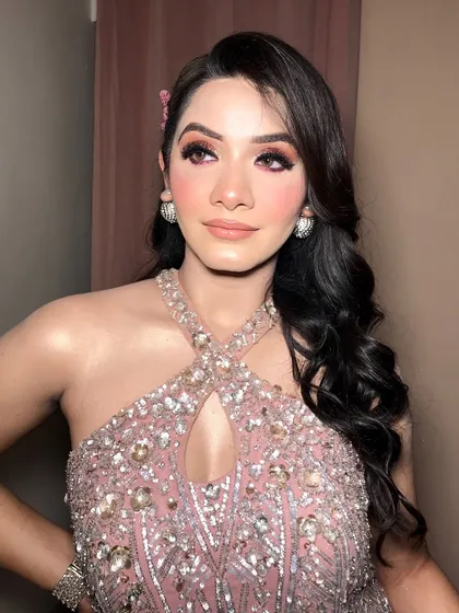 Another angle of this stunning engagement look, highlighting the side-swept Hollywood waves and butterfly hair accessories.