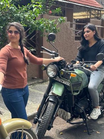 Two graduates, one on a Royal Enfield Himalayan, showcase the variety of bikes our riders can handle after training.