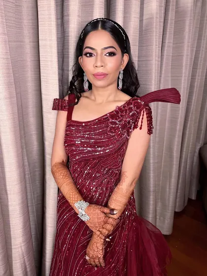 The full look for this chic engagement bride. The Marsala gown, delicate diamond jewelry, and glamorous makeup create a timeless and sophisticated style.