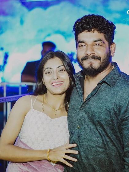 A couple poses for a photo at a New Year's Eve event. My parties provide a festive and romantic setting for couples to celebrate.