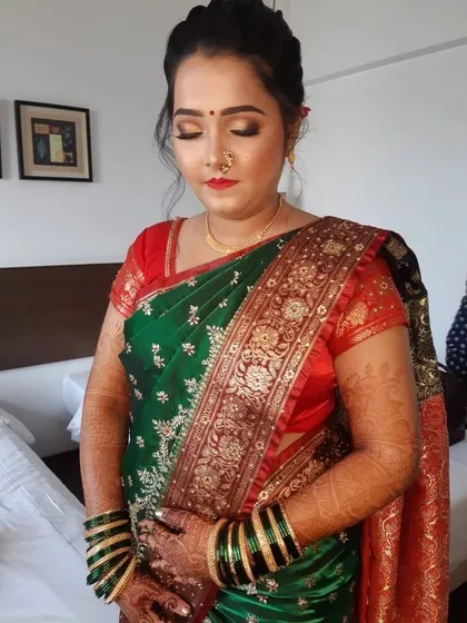 A candid moment showing the complete look. The makeup is designed to last through all the ceremonies while looking effortlessly beautiful.