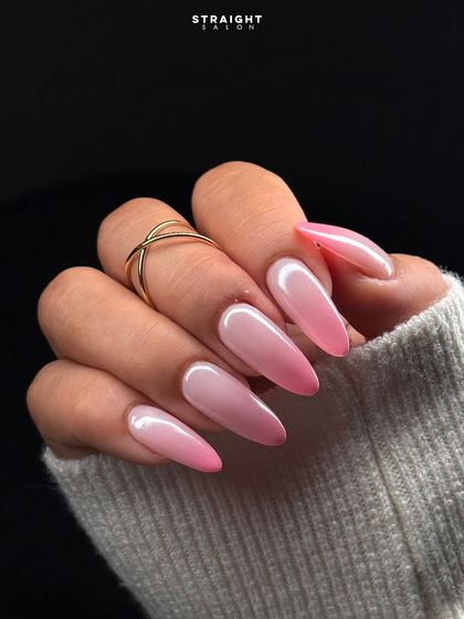 A perfect example of a soft pink ombre, or 'baby boomer' nails. The seamless blend from a milky white base to a soft pink tip is timeless and elegant.