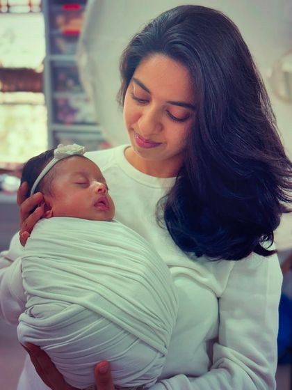 My magu nodi. Holding my newborn daughter, swaddled and peaceful. This is the 'why' behind everything I do.