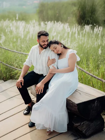 An intimate and tender portrait set against a backdrop of lush greenery. We focus on capturing the quiet, unspoken connection between a couple, resulting in authentic and emotional photographs.