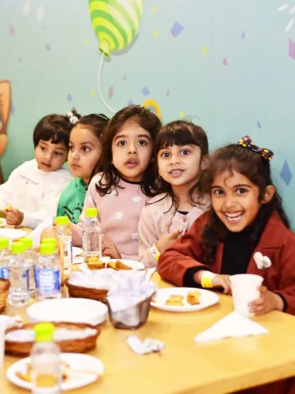 A group of young students enjoying their snacks together. Our venue is perfect for organized and supervised group events.