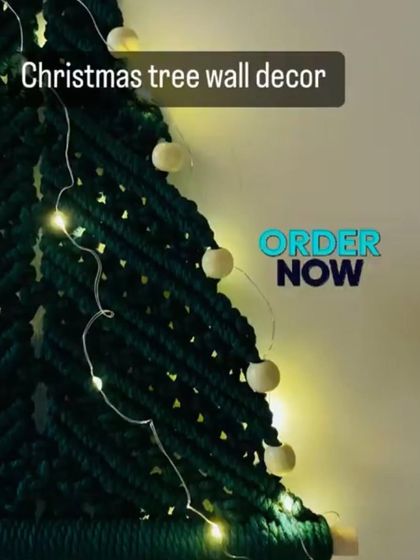 My macrame Christmas tree wall decor, complete with wooden beads and fairy lights. It's a unique and stylish way to decorate your wall for the festive season.