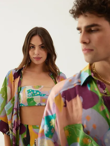 A shot from Tizzi's swimwear campaign, featuring both male and female resort wear for a couples' vacation theme.