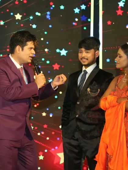 A candid moment of interaction with the couple during their reception. These personal conversations on stage make the event feel more intimate and special.