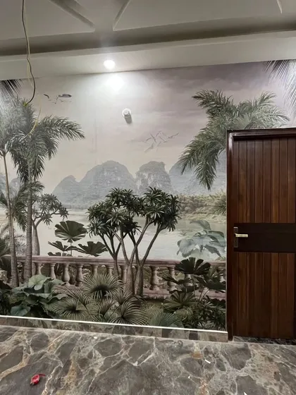 This scenic mural creates the illusion of a view from a balcony overlooking a tropical landscape. It's a great way to add depth and a sense of escape to a room without windows.