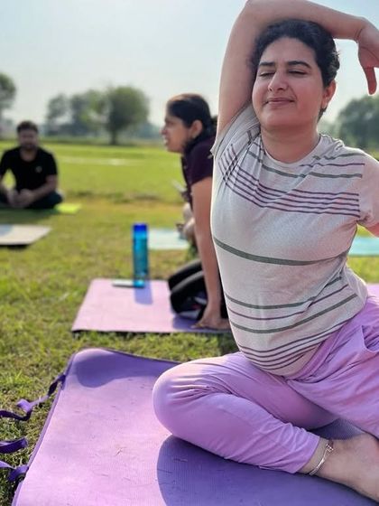 A close up of a student in Mermaid pose. You can see the focus and peace on her face.