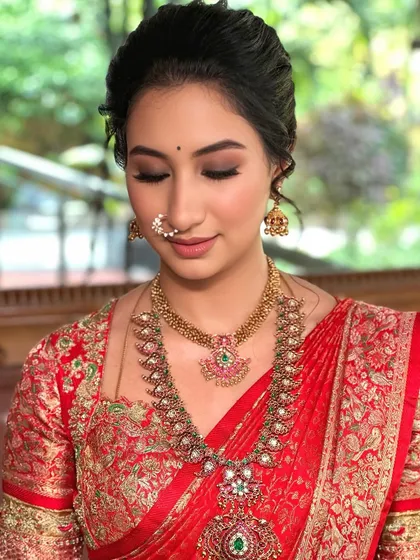 A close-up of the soft smokey eye and traditional nose ring, a perfect blend of modern and classic styles.
