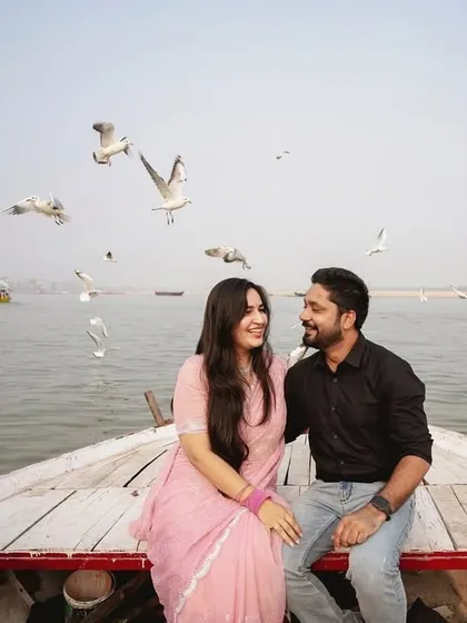 Our photography focuses on capturing your unique story. This pre-wedding photoshoot in Banaras uses the natural beauty of the Ganges and the morning light to create a timeless, romantic portrait of the couple on a traditional boat.