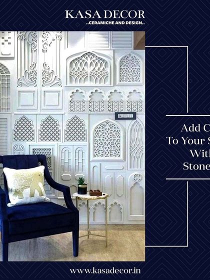 Our stone tiles used to create a charming accent wall. The intricate, traditional patterns provide a stunning backdrop for the modern, deep blue armchair.