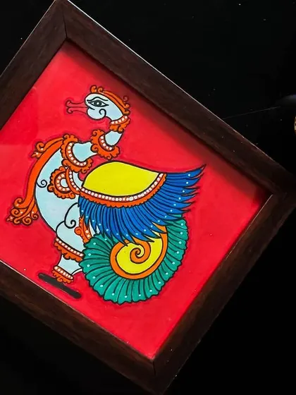 The Hamsa, or divine swan, represents beauty and balance. I painted this in the Kerala mural style against a bold red background to make the colors pop. This 9x10 inch framed piece is a small symbol of elegance.