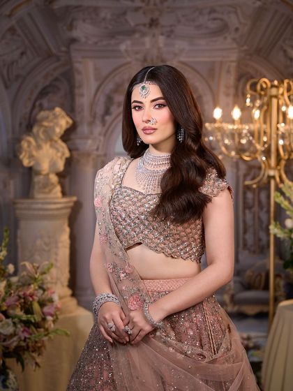 A stunning portrait of the modern bride. The makeup is soft, romantic, and perfectly suited for a grand, elegant setting.