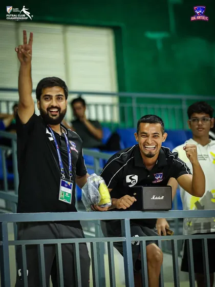 Our management team celebrating in the stands after the semi-final win.