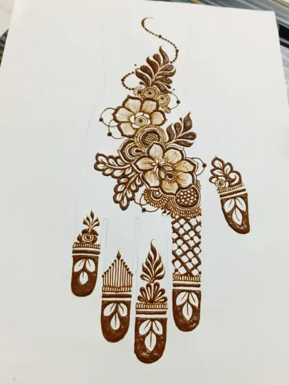 This is a full Arabic-style hand design, a very popular and in-demand style. My course covers how to structure these flowing patterns, balance floral elements with geometric fillers, and design finger details that complete the look.